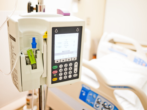 Intravenous IV drip medical machine in a hospital room