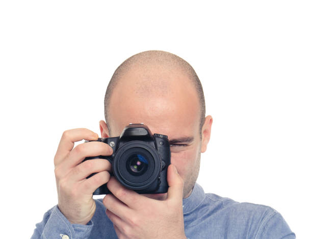 istock Photographer at work, isolated on white 157727312