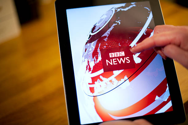 bbc news on iPad2  bbc photos stock pictures, royalty-free photos & images