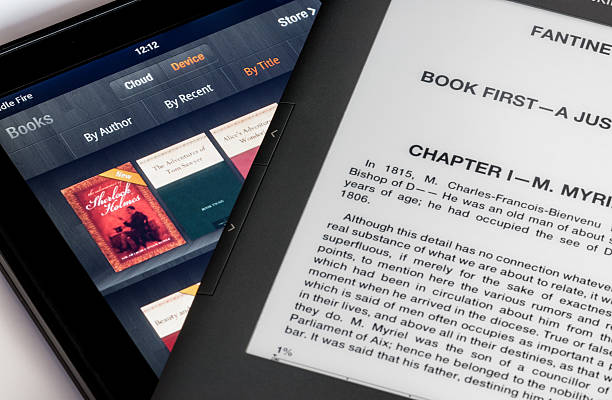 Screen comparison of Kindle Fire table and Keyboard ebook stock photo