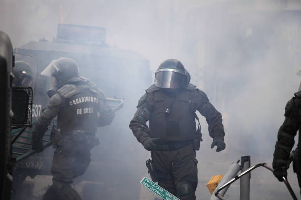 Riot Police  tear gas stock pictures, royalty-free photos & images