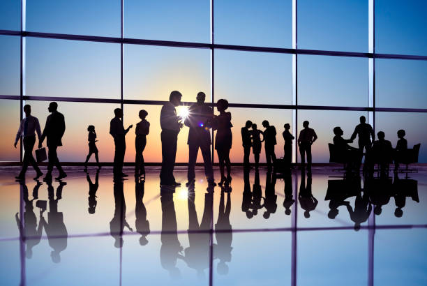 istock People working in a busy international office. 157728042