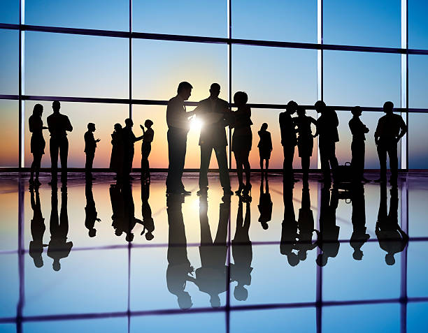 istock People working in a busy international office. 157728044
