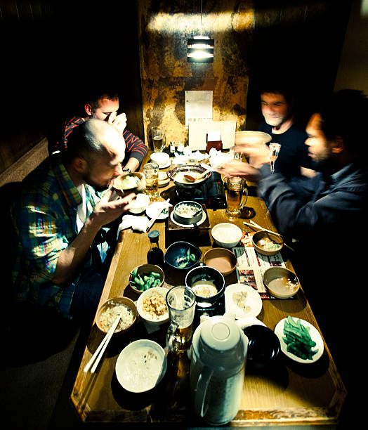 japanische speisen - eating men food chopsticks stock-fotos und bilder