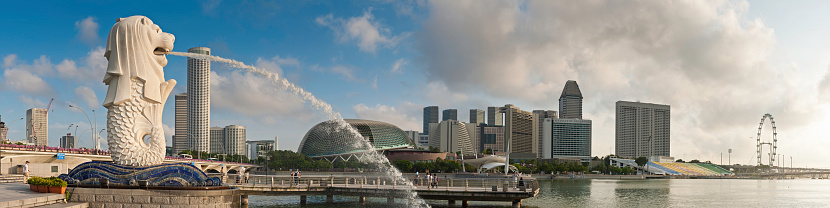Singapore, Singapore – October 23, 2022: A stunning view of the bay with the lion fountain and Singapore skyline with modern glass skyscrapers