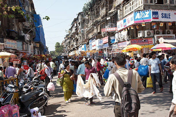 Busy Mumbai street corner at Crawford Market stock photo