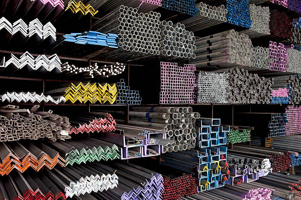 Looking for the right angle! Various angle iron profiles and steel rods kept in storage shelves in a steel shop. construction material stock pictures, royalty-free photos & images