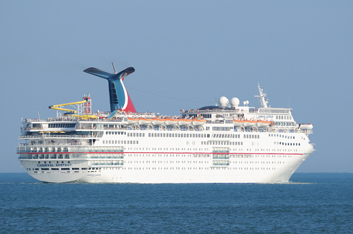 Port Canaveral, Florida, USA- February 23, 2012: The Cruise ship Carnival Ecstasy heads to sea from Port Canaveral