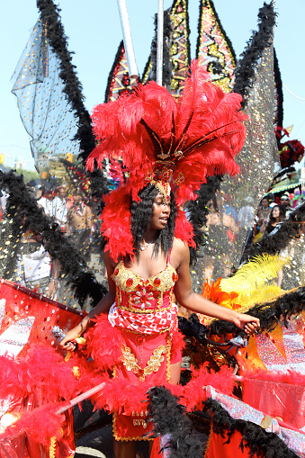 Young man  dressed in bright and vibrant colors at the Boxing Day Junkanoo parade in Nassau, The Bahamas