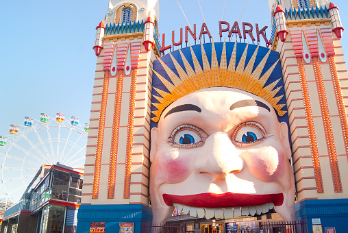 Niagara Falls, Ontario, Canada - September 24, 2020:  On Clifton Hill Street at Niagara Falls, you can see Ripley's Moving Theatre 4D, Frankenstein, Burger King, IHOP, Applebees, hotel and casino. On the street you can see people and a car on the road.