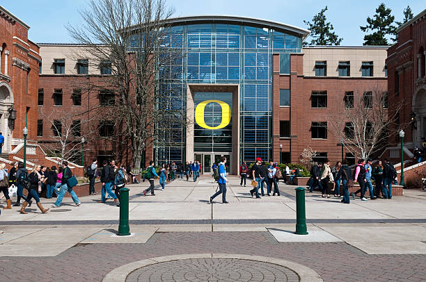 University of Oregon Students walk on the University of Oregon campus in the city of Eugene in April 2012. university of oregon stock pictures, royalty-free photos & images