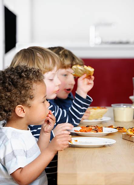 istock Row Of Toddlers Having A Meal 157729352