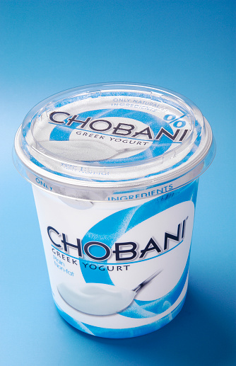 Belmont, North Carolina, USA - April 9, 2012: An isolated 32 FL OZ (One Quart) carton of plain, non-fat, CHOBANI® Greek Yogurt. Distributed by Agro Farma, Inc., New Berlin, New York.