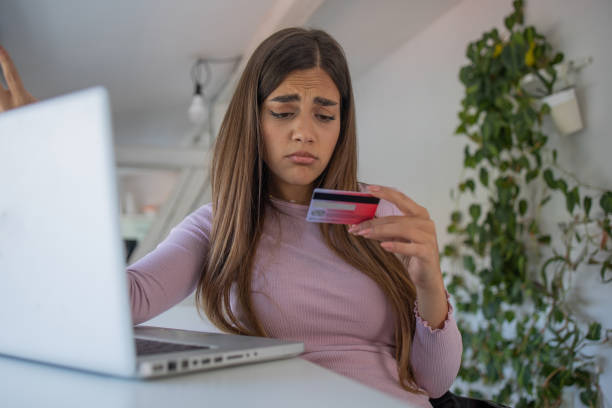 istock Cheerful  young woman doing online shopping 1577297025
