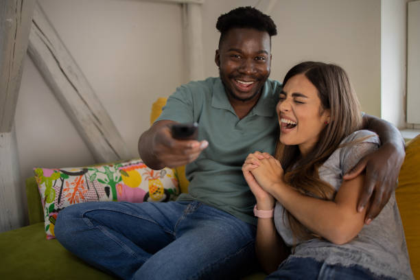 istock Young couple watching TV 1577298177