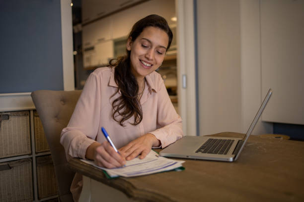 istock Young woman working from home 1577300368