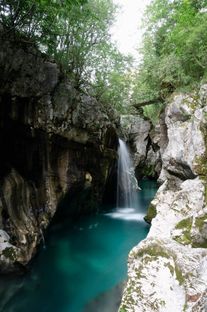 istock Beautiful waterfall in the big gorge rock cliffs of emerald soca river 1577305726