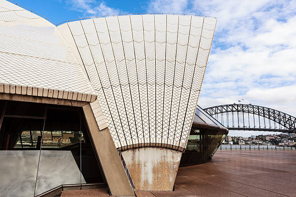 Sydney Australia - August 3, 2019: Morning sunlight shines down on the instantly recognisable roofline of the Sydney Opera House in Australia.