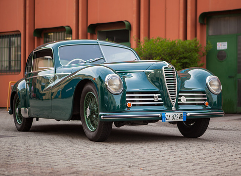 Gessertshausen, Germany - September 25, 2022: 1979 Saab 96 swedish oldtimer vintage rallye racing car in a picturesque landscape.