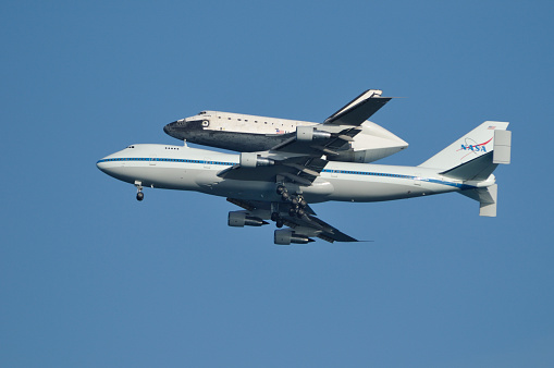Cape Canaveral,  Florida, USA - June 2, 2009: A Boeing 747 flying with the Space Shuttle Atlantis piggy-backed on top. The Atlantis returning to the Kennedy Space Center after landing at Edwards Air Force Base in California at the end of it's last mission.