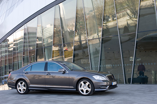 Tulsa, United States – August 20, 2022: A closeup of a white 2021 Genesis G80 with a dark background