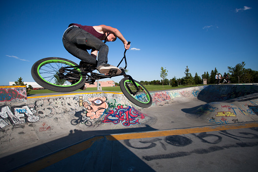 Brussels, Belgium - July 18, 2015: BMX Biker in action at the skate park in central Brussels.The Ursulines square is a public open square in skateboarding, BMX, inline skating, etc.
