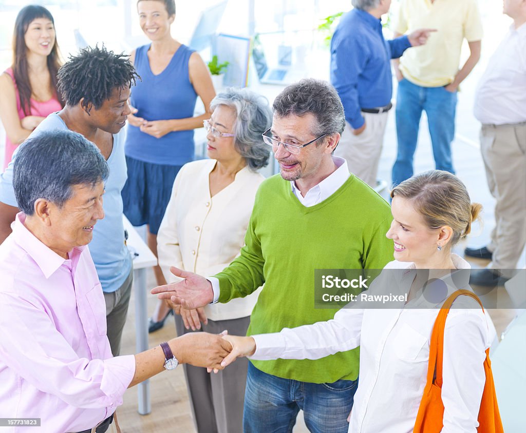 Diverse adults talking together  Adult Stock Photo