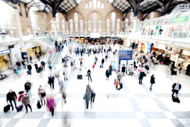 Commuters at a London railway station station.  