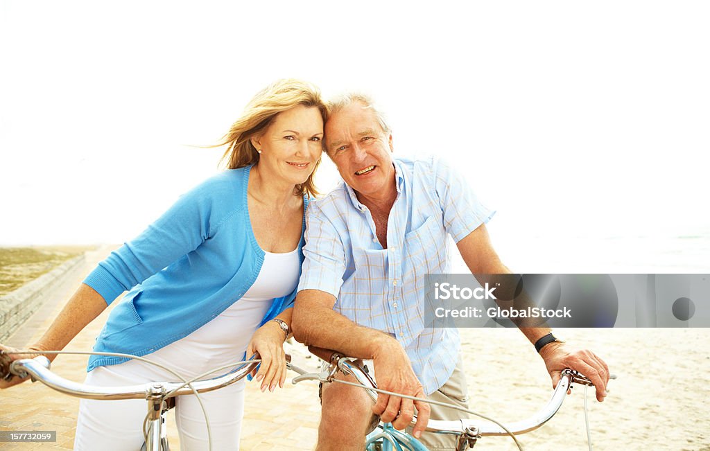 We lean on each other still to this day Portrait of senior couple riding their bikes together Active Lifestyle Stock Photo