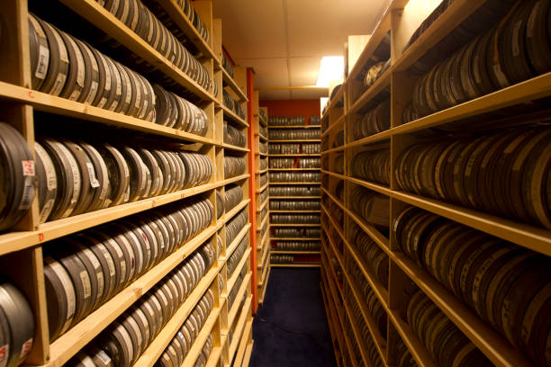 Vintage 8mm home movies on film reels with film leaders and spools.