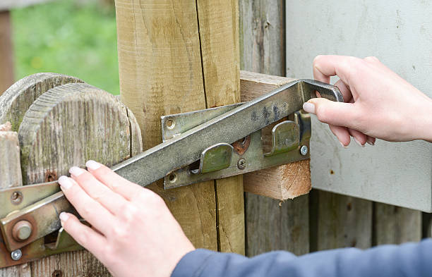 istock open the gatter - open the latch and unlock it 157732135