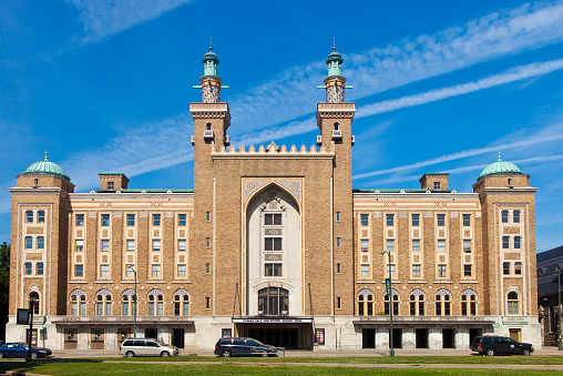 Brick building against blue sky, symbolizing stability and architectural legacy