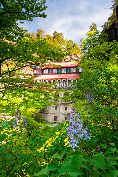 pravcicka taken Pravcicka brana, Czech Republic - May 5, 2012: Pravcicka brana (gate) is the largest (16m high) natural stone arch in europe and the most beautiful sandstone formation in czech switzerland. Beside the gate is a historical restaurant called falcon's nest. It was built in 1881. This place is one of the main attractions for tourists and hikers in the region. pravcicka stock pictures, royalty-free photos & images