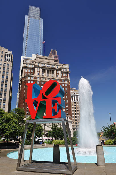 Center city of Philadelphia covered in snow, Photographed on 1/19/24. The Love sculpture is on public display. It is a famous monument by Robert Indiana located in the center city Phildelphia at JFK Plaza