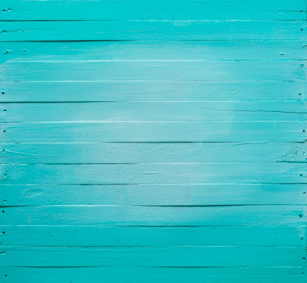 Old turquoise wooden panel background. Composite image.