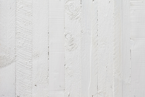 Old white wooden fence background.