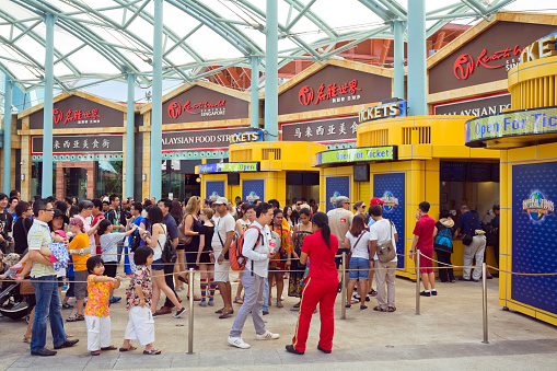 Niagara Falls, Ontario, Canada - September 24, 2020:  On Clifton Hill Street at Niagara Falls, you can see Ripley's Moving Theatre 4D, Frankenstein, Burger King, IHOP, Applebees, hotel and casino. On the street you can see people and a car on the road.