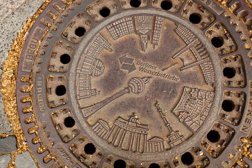 Manhole cover design, city centre, Copenhagen, Denmark. Copenhagen, Denmark’s capital, lies on the coastal islands of Zealand and Amager. Indre By, the city's historic centre, contains Nyhaven and Frederiksstaden, with the royal family’s Amalienborg Palace. Also, Christiansborg Palace and the Renaissance Rosenborg Castle, which is surrounded by gardens, is home to the crown jewels
