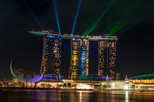 Singapore - Jun 17, 2022: A view of two iconic landmarks, Apple Store Marina and Marina Bay Sands in Singapore.