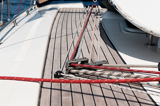 Details of ropes and stoppers on a sailing boat deck.