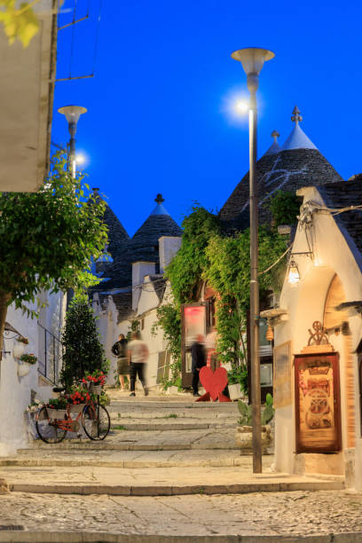 istock Alberobello trulli house in Italy at dusk 1577347955