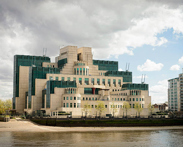 SIS (Secret Intelligence Service or MI6) Building in London Located next to Vauxhall Bridge on the River Thames, the SIS Building (or MI6 Building)  is the headquarters of the British Secret Intelligence Service.  The building opened in 1994. mi6 stock pictures, royalty-free photos & images