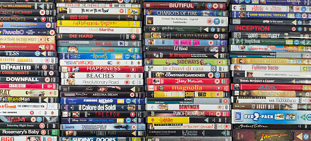 Large collection of movie DVDs, stacked stock photo
