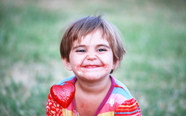 istock Cute girl with lollypop 157735352