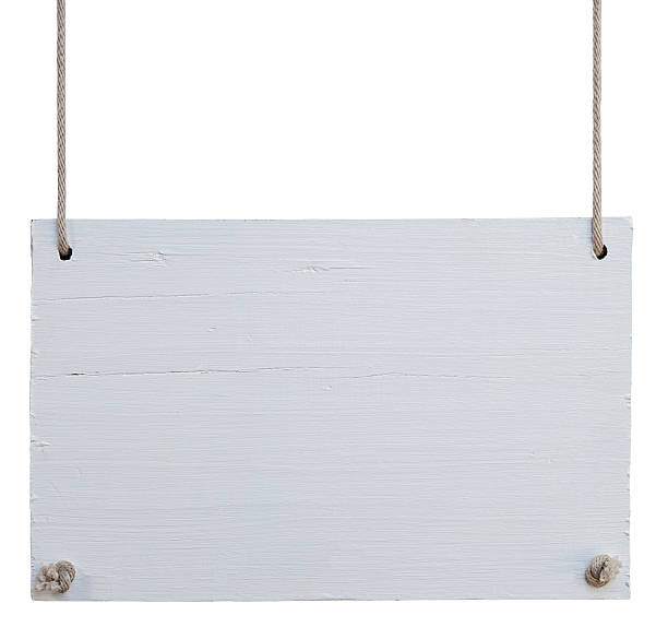 Old weathered white wood signboard. stock photo