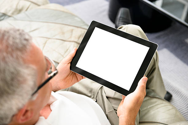 istock Human hand holding black digital tablet with blank screen 157735905
