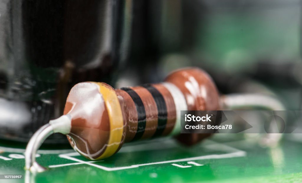 Electronic Board detail Close up of an highly integrated electronic board. Resistor Stock Photo