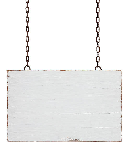 Old weathered white wood signboard. Old weathered white wood signboard, hanging by old chains, composite image, isolated on white, clipping path included. rusted chain stock pictures, royalty-free photos & images