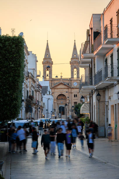 istock Alberobello Cathedral street, Puglia 1577368542