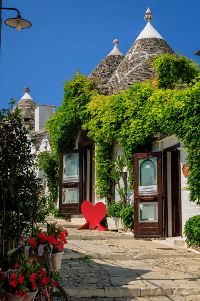 istock Trulli in Alberobello alley, Puglia 1577368566